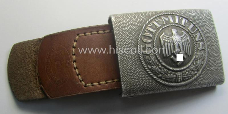 WH (Heeres) 'standard-pattern', field-grey-toned- and aluminium-based belt-buckle being a maker- (ie. 'Jul. Kremp'-) marked- and/or: '1939'-dated example that comes mounted onto its leather-based tab