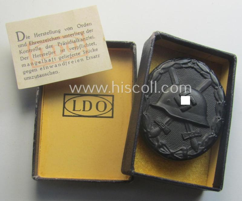 'Verwundeten-Abzeichen in Schwarz' being a maker- (ie. 'L/21'-) marked example by the company: 'Förster & Barth' and that came stored in its typical 'LDO'-type etui (ie. two-pieced-box)