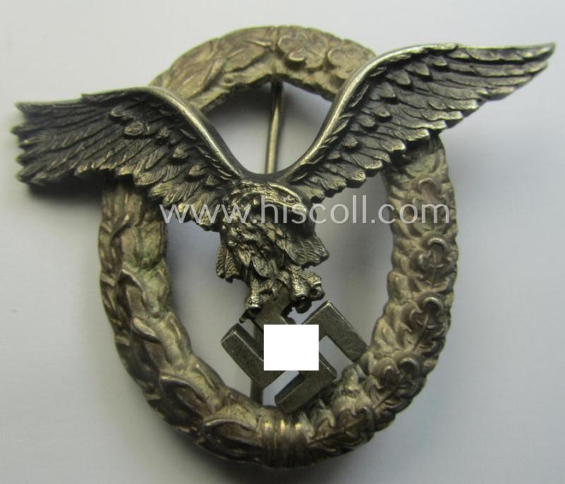 Early- (ie. pre-) war-period- and/or: 'Buntmetall'- (ie. 'Tombak'-) based: WH (Luftwaffe) 'Flugzeugführerabzeichen' (or: pilots-badge) being a clearly maker- (ie. 'C.E. Juncker'-) marked example of the 'J2'-pattern