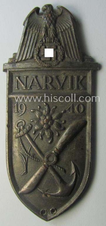 Truly worn - but regrettably incomplete but nevertheless rarely encountered! - WH (Heeres) 'Narvik'-campaign-shield as executed in silver-toned 'Buntmetall' (ie. Cupal) and that comes in a clearly issued- (and once tunic-attached-), condition