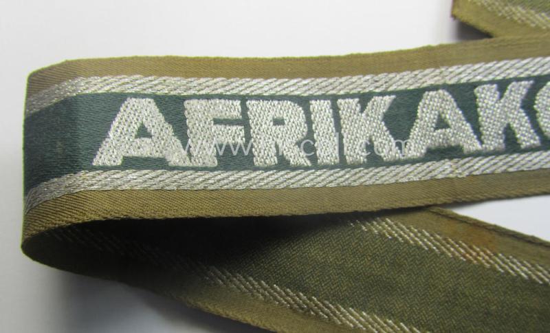 'BeVo'-like cuff-title (ie. 'Ärmelstreifen') entitled: 'Afrikakorps' being a presumably issued but simply never worn example that comes in an overall very nice- (ie. non-shortened- and never tunic-attached-), condition