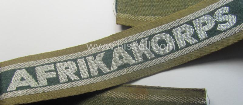 'BeVo'-like cuff-title (ie. 'Ärmelstreifen') entitled: 'Afrikakorps' being a presumably issued but simply never worn example that comes in an overall very nice- (ie. non-shortened- and never tunic-attached-), condition