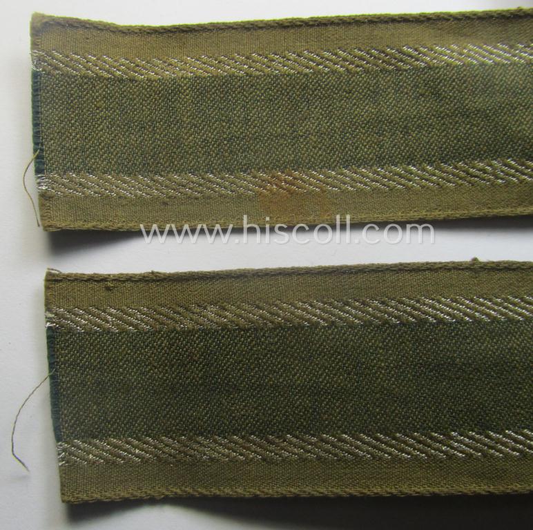 'BeVo'-like cuff-title (ie. 'Ärmelstreifen') entitled: 'Afrikakorps' being a presumably issued but simply never worn example that comes in an overall very nice- (ie. non-shortened- and never tunic-attached-), condition