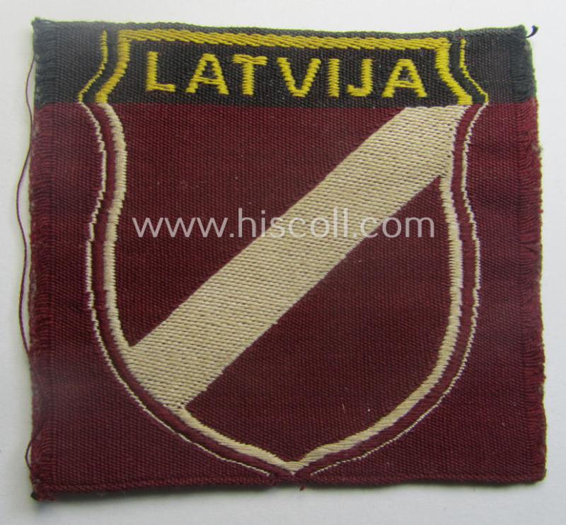 Locally produced(!), 'Waffen-SS'-type armshield as executed in the so-called: 'semi-BeVo'-pattern entitled: 'Latvia' as was merely intended for usage by the members of the: 'Latvian Legion'