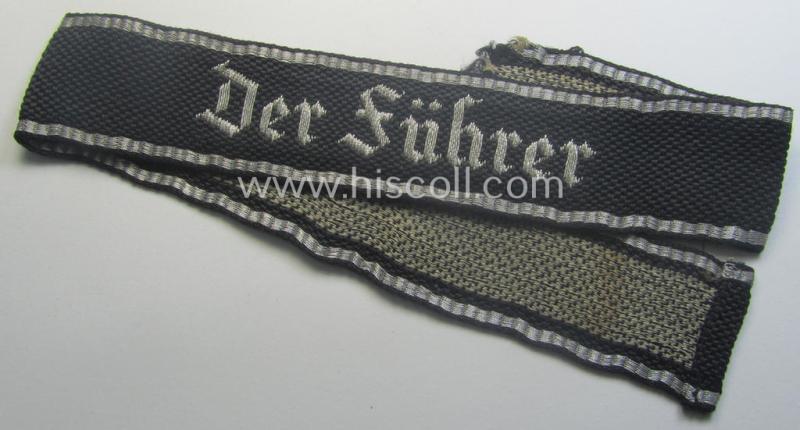 Truly used- and/or carefully tunic-removed example of a: Waffen-SS 1939/40-pattern, officers'-type 'flat-wire'-woven cuff-title (ie. 'Ärmelstreifen für Führer'): Regiment 'Der Führer' (2. SS-Pz-Div. 