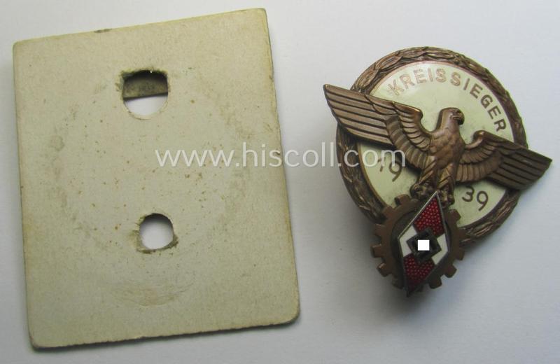 'HJ'- ('Hitlerjugend') ie. 'BDM'-related: 'Reichsberufswettkampf-Siegerabzeichen' (of the 2nd model) entitled: 'Kreissieger 1939' and being a maker- (ie.: 'Ferd. Wagner'-) marked example that comes with its period 'etui-inlay'