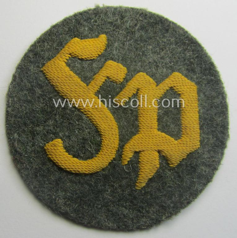 WH (Heeres) so-called: trade- and/or special-career arm-insignia as was intended for a: 'Festungspionier-Feldwebel' (being a neatly hand-embroidered 'variant' as mounted on field-grey-coloured wool)