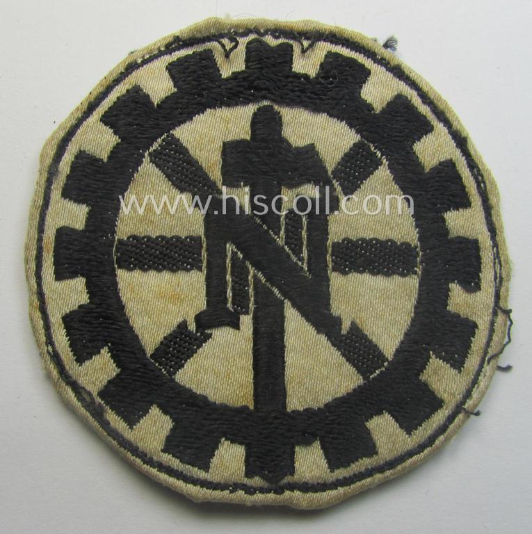 Truly used - and most certainly scarcely found! - Dutch-related, TeNo- (ie. 'Technische Nothilfe'-) related armband-patch (ie. 'Abz. für den TeNo-Armbinde') being of the 'BeVo-woven'-type showing the typical 'TeNo'-symbol