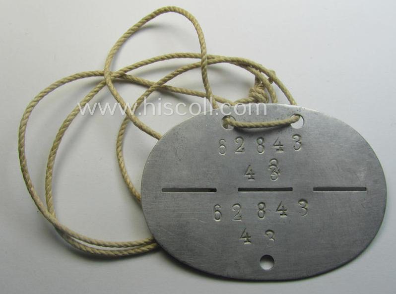 Aluminium-based, WH (LW) ie. 'Fallschirmjäger'-related ID-disc bearing the clearly stamped- and/or: 'coded'-unit- ie. 'MOB'-designation that reads: '62843' (and as such belonging to the: '2./Fsch.Jg.Rgt. 1')