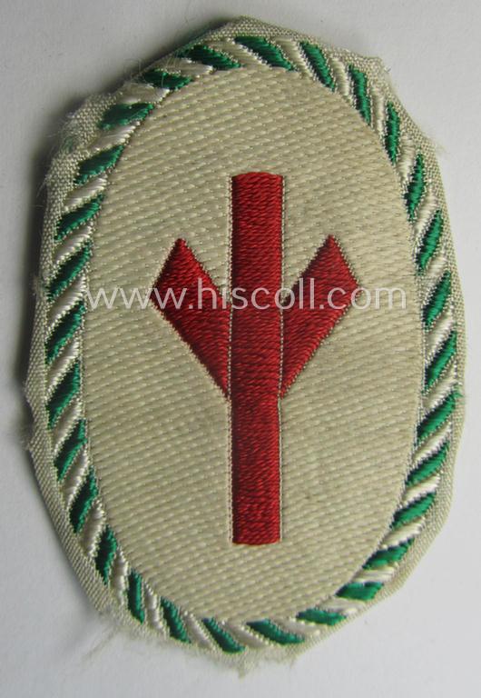 HJ/BDM (ie. 'Hitlerjugend'/'Bund Deutscher Mädel') trade- ie. specialist-armbadge as executed in neat 'BeVo'-weave pattern as was specifically intended for a: 'Gefolgschaftsfeldscher' that still retains its 'RzM'-etiket