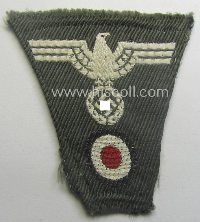 'Foreign-produced' (!) WH (Heeres) related, so-called: 'M43-pattern'-cap-trapezoid (ie. 'Mützentrapez') as executed in machine-woven- (ie. BeVo-like-) pattern onto a typical greenish-/field-grey-coloured- and/or linnen-based background