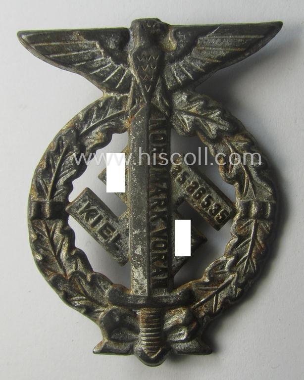 Commemorative, tarnished-silver-coloured- and/or tin-based, N.S.D.A.P.- (ie. SA-) related 'tinnie' being a non-maker-marked example depicting an upward-positioned sword, swastika and text that reads: 'Nordmark Voran - Kiel - 25.26.5.1935'