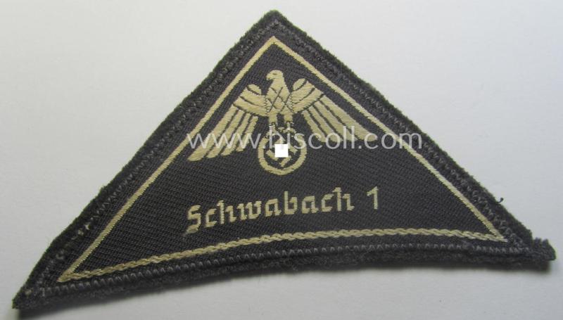 German Red Cross (ie. 'Deutsches Rotes Kreuz' or 'DRK') related, EM- (ie. NCO-) type, greyish-coloured- and/or (typically) triangular-shaped arm-eagle as executed in the neat 'BeVo'-weave pattern entitled: 'Schwabach 1'