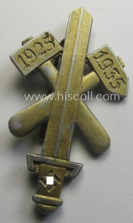 Commemorative - aluminium-based- and/or golden-toned - N.S.D.A.P.- (ie. 'Gau Essen'-) related 'tinnie', being a maker- (ie. 'Hofstätter'-) marked example depicting a sword with crossed hammers and depicting the dates: '1925-1935'
