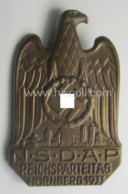 N.S.D.A.P.-related 'tinnie' (ie. 'Tagungs- o. Veranstaltungsabzeichen'-) being a non-maker-marked, 'hollow-back'-pattern and/or golden-bronze-toned example showing the text: 'N.S.D.A.P. Reichsparteitag - Nürnberg 1933'