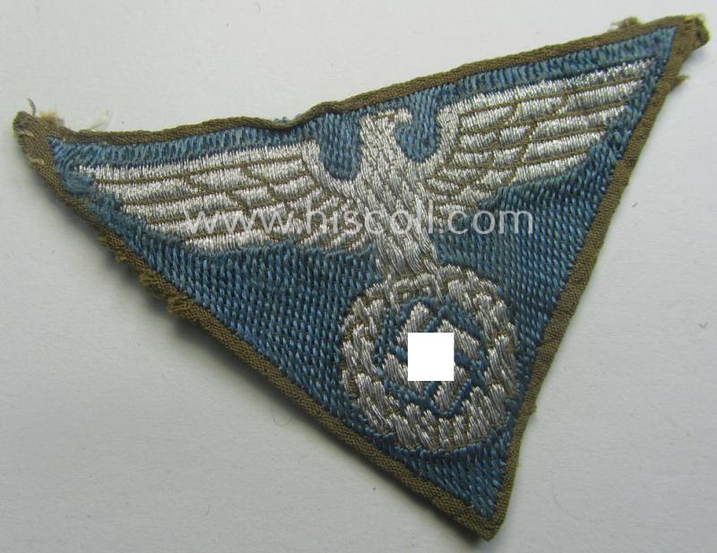 SA-related cap-eagle as was intended for the: 'Lagermütze' (ie. side-cap) being an example as woven on a bright-blue-coloured background and as such intended for members within the: 'SA-Gruppe Warthe o. Oberrhein'