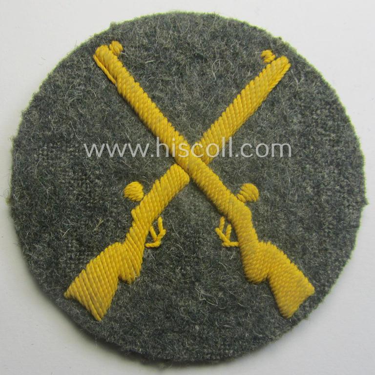 Truly used- and/or tunic-removed, WH (Heeres) trade- and/or special-career insignia (ie. neatly hand-embroidered 'Laufbahn- o. Tätigkeitsabzeichen') as was intended for a: 'Waffenmeister' (or: weapon-equipment NCO)