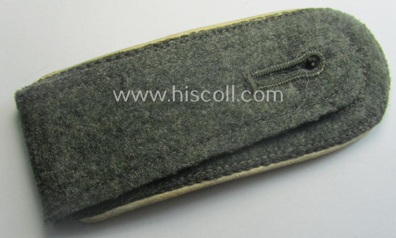 Single, WH (Heeres) NCO-type (ie. 'M40'- ie. 'M43'-pattern) shoulderstrap having the white-coloured branchcolour as was intended for - and clearly worn by! - a: 'Feldwebel der Infanterie-Trpn.'