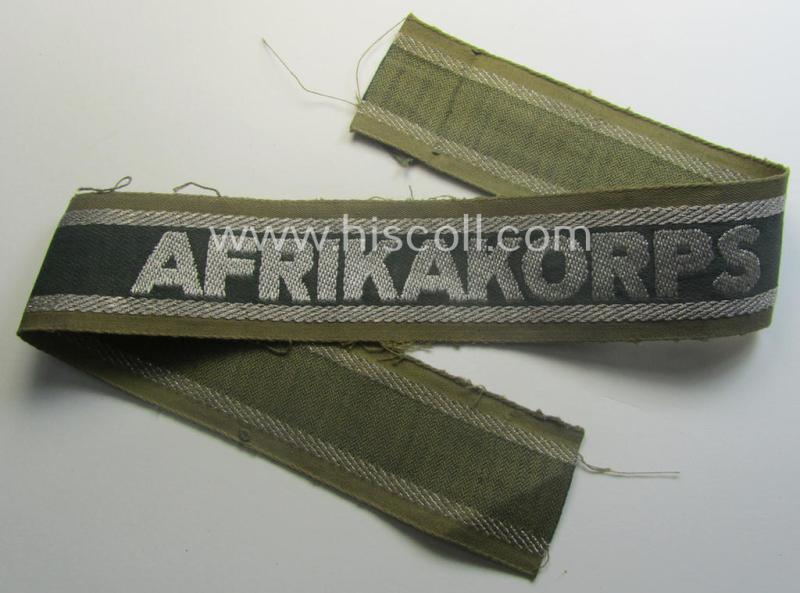 Truly worn, 'BeVo'-like cuff-title (ie. 'Ärmelstreifen') entitled: 'Afrikakorps' being a with certainty issued example that comes in an overall nice- (ie. hardly shortened- and/or once tunic-attached-), condition