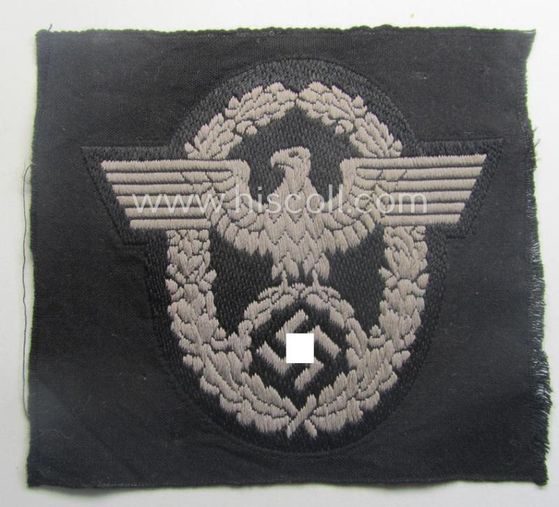 Police- (ie. 'Polizei- o. Panzer'-) related armbadge (ie. arm-eagle) being a typical 'BeVo'-woven example (as was specifically produced for usage onto the black-coloured, 'wrap-around'-styled Panzer-tunics)