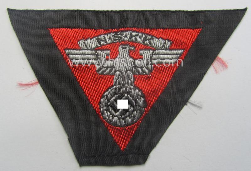 Never used - ie. 'virtually mint'! - so-called: N.S.K.K. (ie. 'National Soc. Kraftfahr Korps') side-cap-eagle (ie. 'Adler für Schiffchenmütze') being a 'flat-wire-woven'-example that comes mounted onto a bright-red-coloured background