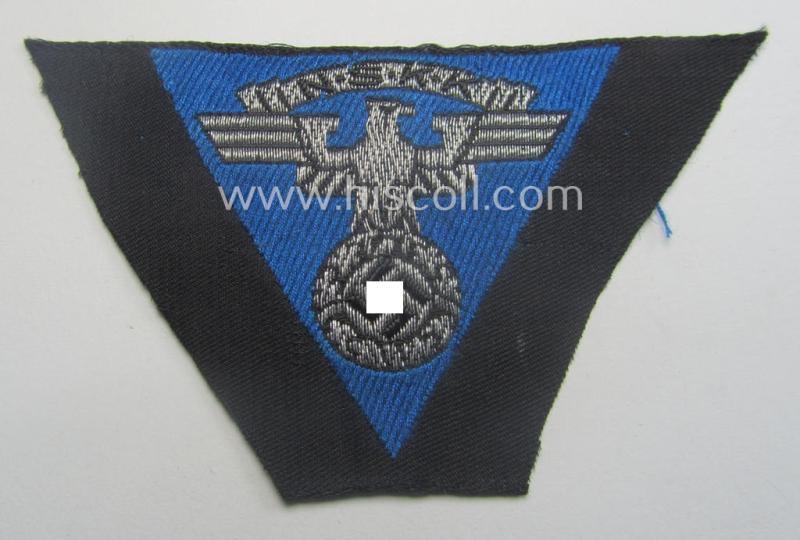 Never used - ie. 'virtually mint'! - so-called: N.S.K.K. (ie. 'National Soc. Kraftfahr Korps') side-cap-eagle (ie. 'Adler für Schiffchenmütze') being a 'flat-wire-woven'-example that comes mounted onto a cornflower-blue-coloured background