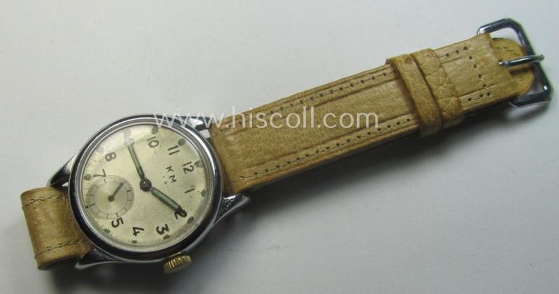 WH (Kriegsmarine) WWII-period wrist-watch (or: 'Dienstuhr') of the make: 'K.M. Siegerin' having a beige-white-coloured dial-plate and neatly engraved number on its back that reads: '328949'