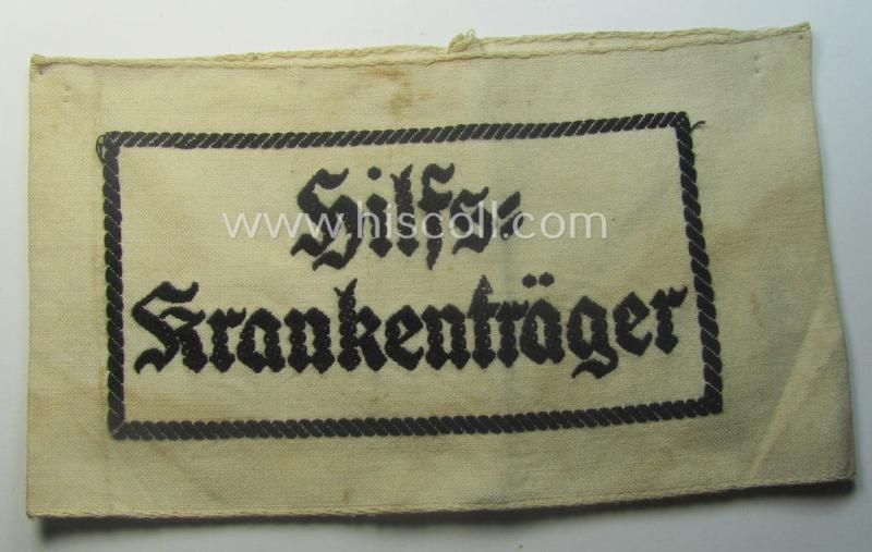 Beige-white-coloured- and/or linnen-based armband (ie. 'Armbinde') as was executed in the 'thicker-styled' fabric as was intended for WH (Heeres) staff-members working as: 'Hilfs-Krankenträger'