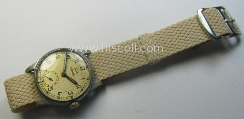 WH (Kriegsmarine) WWII-period wrist-watch (or: 'Dienstuhr') of the make: 'K.M. Siegerin' having a beige-white-coloured dial-plate and neatly engraved number on its back that reads: '120728'