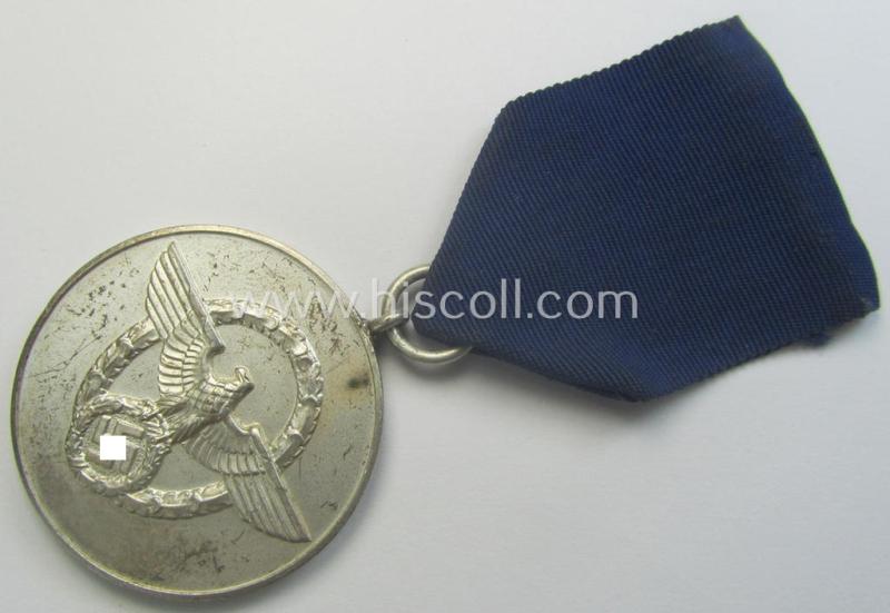 Bright-silver-toned so-called: 'Polizei-Dienstauszeichnung 3. Stufe' (or: police loyal-service medal 3rd class) that comes mounted onto its period ribbon (ie. 'Bandabschnitt')