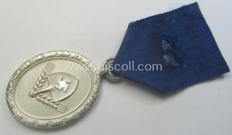 RAD (ie. 'Reichsarbeitsdienst') so-called: 'Dienstauszeichnung 3. Stufe für Männer' (as was intended for 12 years loyal-service) and that came mounted onto its period piece of ribbon (ie. 'Bandabschnitt')