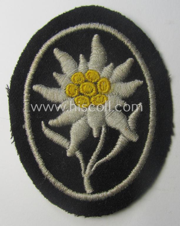 Waffen-SS-pattern, black-coloured sleeve-insignia (ie. 'Ärmelabzeichen') depicting an: 'Edelweiss'-flower as used by the various 'Gebirgsjäger'- (ie. mountain-troops-) related divisional-staff