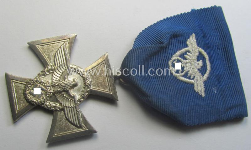 Silver-class 'Pol.-Dienstauszeichnung 2. Stufe' (or: police loyal-service medal second-class) that comes mounted onto its (typically broader-shaped) ribbon (ie. 'Bandabschnitt')