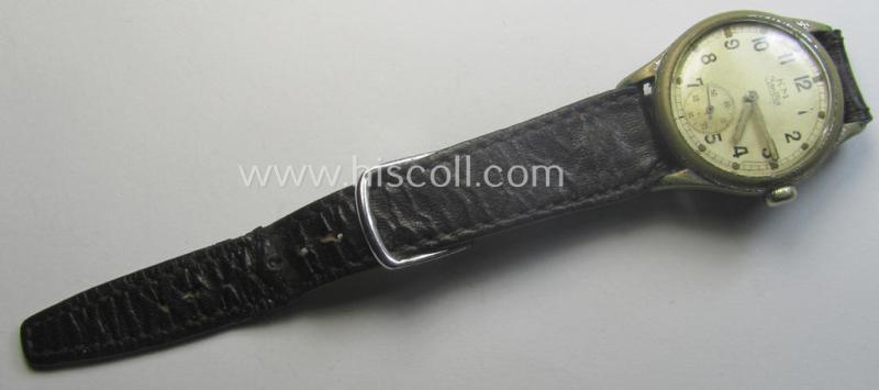 WH (Kriegsmarine) WWII-period wrist-watch (or: 'Dienstuhr') of the make: 'K.M. - Zentra' having a beige-white-coloured dial-plate and neatly engraved number on its back that reads: '528261'