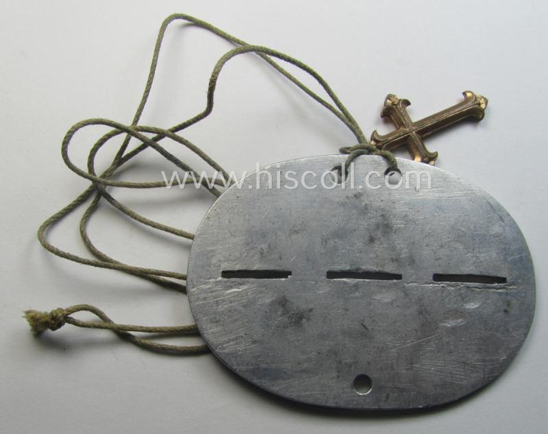 Zinc-based WH (Heeres) 'Heeres-Flak'- ie. 'GrossDeutschland-Division'-related ID-disc bearing the clearly stamped unit-designation that reads: '3./H.FlakArt.Abt. G.D.' and that comes mounted onto its period cord as worn