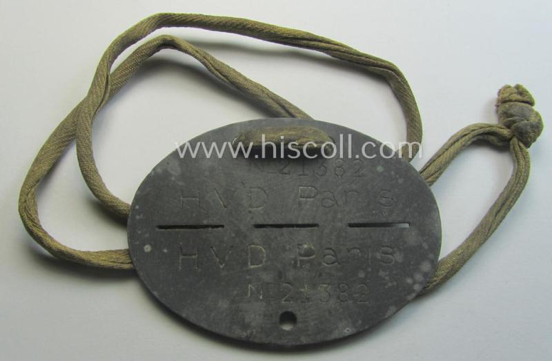 Zinc-based, 'Deutsche Reichsbahn'- (ie. DRB-) related ID-disc bearing the clearly stamped unit-designation that simply reads: 'HVD Paris' and that comes as issued and/or worn