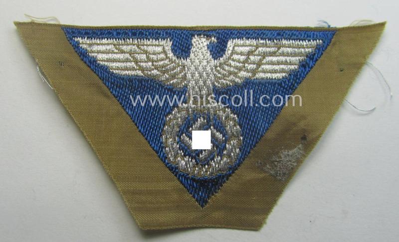 SA-related cap-eagle as was intended for the: 'Lagermütze' (ie. side-cap) being an example as woven on a typical bright-blue-coloured background and as such intended for members within the: 'SA-Gruppe Warthe o. Oberrhein'