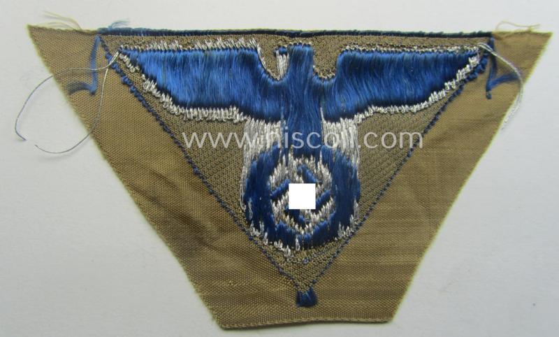 SA-related cap-eagle as was intended for the: 'Lagermütze' (ie. side-cap) being an example as woven on a typical bright-blue-coloured background and as such intended for members within the: 'SA-Gruppe Warthe o. Oberrhein'