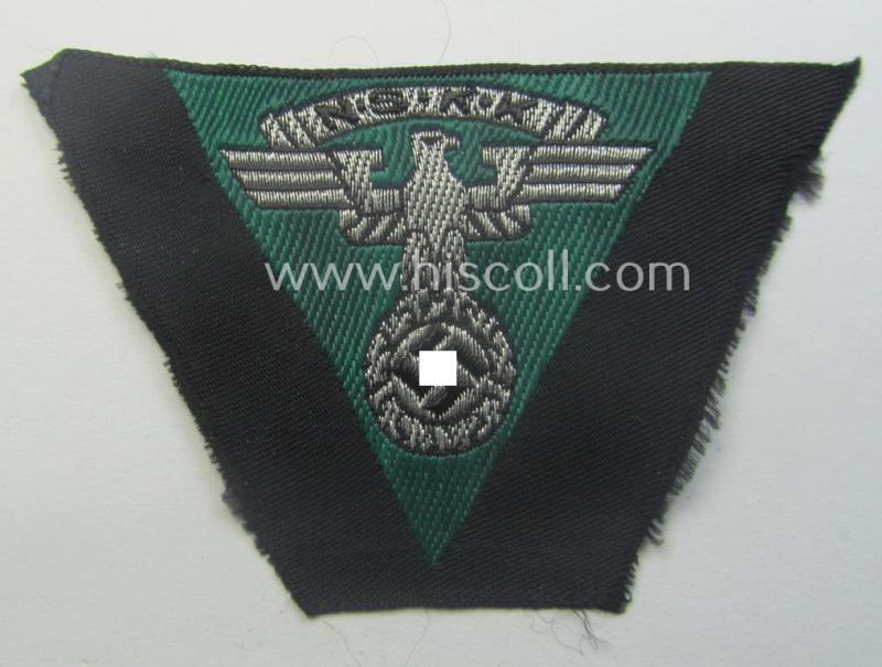 N.S.K.K. (ie. 'National Socialistisches Kraftfahr Korps') side-cap-eagle (ie. 'Adler für N.S.K.K.-Schiffchen o. Lagermütze') being a 'flat-wire-woven'-example onto a darker-green-coloured background