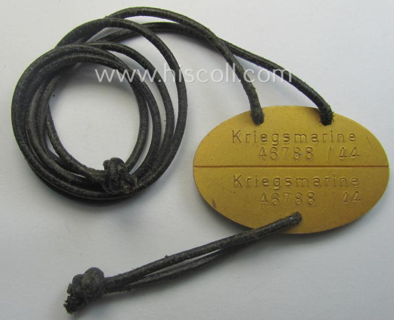 Later-war- (albeit 'standard-issue'-) pattern, WH (Kriegsmarine) typical aluminium-based- and/or bright golden-bronze toned ID-disc (ie. 'Erkennungsmarke') bearing the engraved coded numeral (ie. text) that simply reads: 'Kriegsmarine 46788/44'