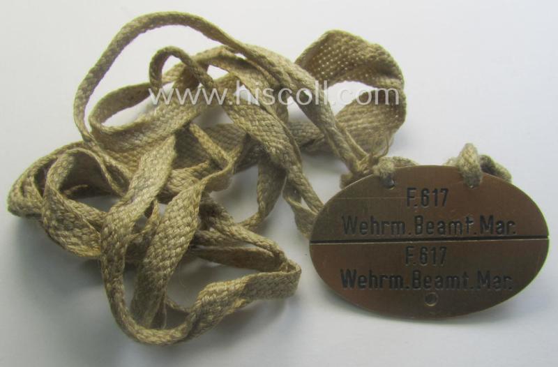 Unusually found - albeit 'standard-issue'-pattern - WH (Kriegsmarine) typical aluminium-based- and/or bright golden-bronze toned ID-disc (ie. 'Erkennungsmarke') bearing the engraved coded numeral (ie. text) that simply reads: 'F.617 Wehr.Beamt.Mar.'