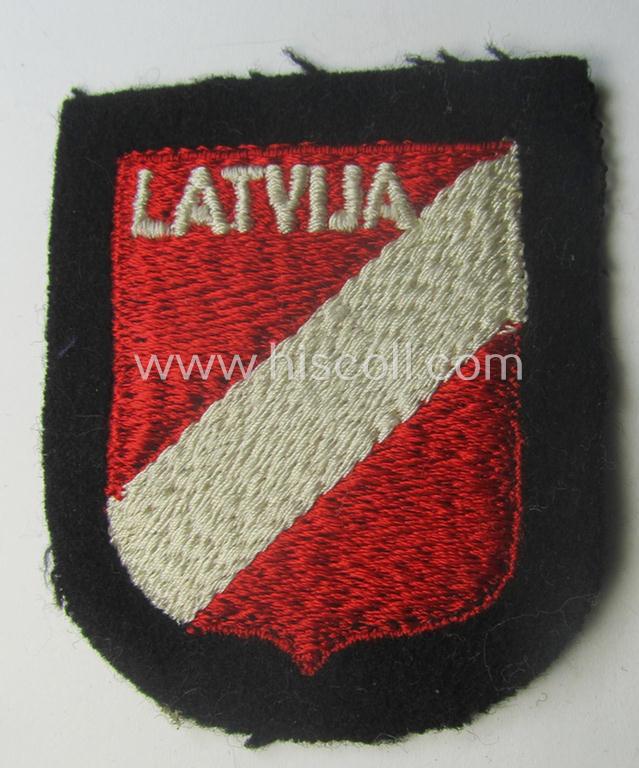 Waffen-SS 'volunteer'-arm-shield as was intended for usage by soldiers of the: '15. o. 19. Waffen-Grenadier-Division der SS' (ie. 'lettische nr. 1 o. 2') and that comes in a 'virtually mint- ie. unissued', condition