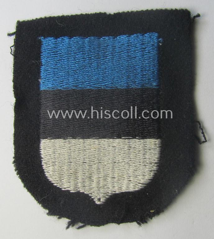 Waffen-SS 'volunteer'-arm-shield as was intended for usage by soldiers of the: '20. Waffen-Grenadier-Division der SS' (ie. 'estnische Nr. 1') and that comes in a 'virtually mint- ie. unissued', condition