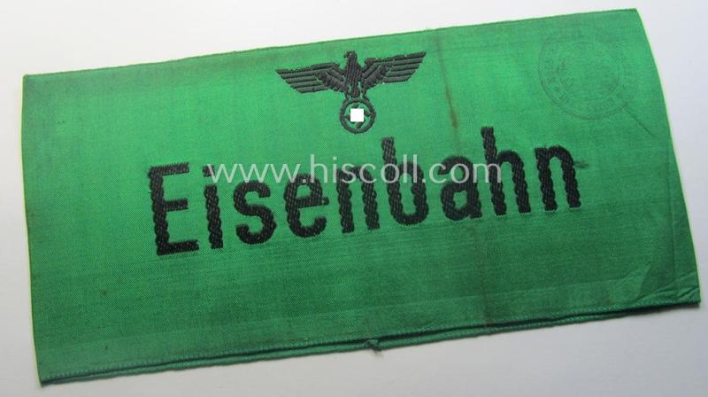 DRB- (ie. 'Deutsche Reichsbahn'-) related armband entitled: 'Eisenbahn' being of the 'entirely-woven'-type onto (typical) silk-like cloth in a technique similar to the 'BeVo'-weave pattern