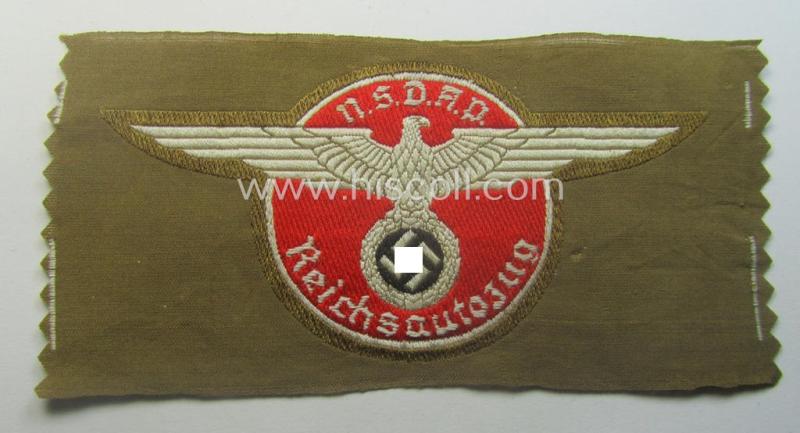 Rarely encountered - and 'virtually mint- ie. unissued' - breast-badge as executed in 'BeVo-weave' pattern as was intended for members within the 'N.S.D.A.P. Reichsautozug' (or: 'RaZ') still retaining its period, paper-based 'RzM'-etiket