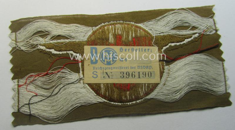 Rarely encountered - and 'virtually mint- ie. unissued' - breast-badge as executed in 'BeVo-weave' pattern as was intended for members within the 'N.S.D.A.P. Reichsautozug' (or: 'RaZ') still retaining its period, paper-based 'RzM'-etiket