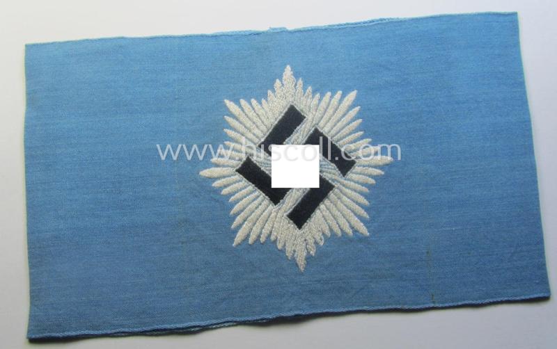 Light-blue-coloured and neatly 'BeVo'-woven, so-called: RLB (or: 'Reichsluftschutzbund') 'Amtsträger'-armband depicting the typical 'RLB'-logo (without lettering) and showing an interwoven makers'-designation (ie. '34'-numeral)