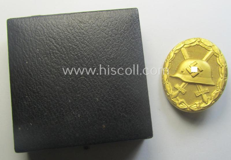 'Verwundeten-Abzeichen in Gold' being a maker- (ie. '30'-) marked- and typical 'Buntmetall'-based example that comes stored in period etui as issued