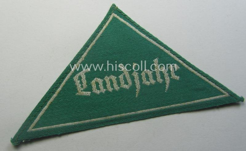 HJ (ie. 'Hitlerjugend') honorary-district-triangle (ie. 'Gebietsdreieck') entitled: 'Landjahr' being an example that still retains its 'RzM'-etiket and that comes in an overall very nice (albeit just moderately used ie. worn condition)