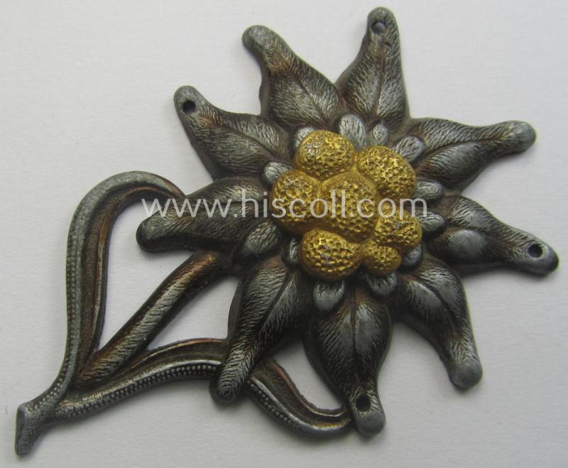 WH (Heeres) (bright) silverish- (ie. golden-) coloured, zinc-based (and neatly maker- ie. 'F&B'-marked) so-called: 'M43'-pattern 'Edelweiss'-cap-badge (ie. 'Mützenabzeichen')